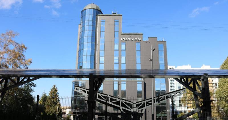 The company's office and parking lot after the appearance of solar panels